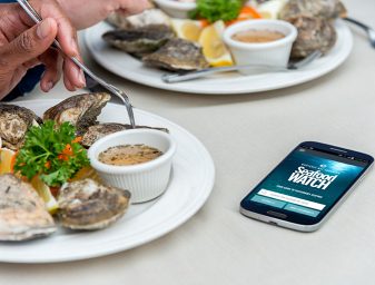 Diners enjoy a sustainable seafood meal with the help of the Monterey Bay Aquarium's Seafood Watch App.